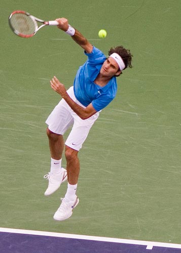 Roger throws his body into his serve.